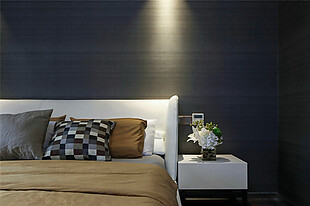 现代卧室深色背景墙室内装修效果图